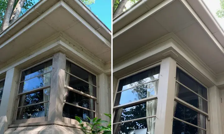 Bay window under painted eaves, before and after a house wash: grey grime on the left, clean on the right.