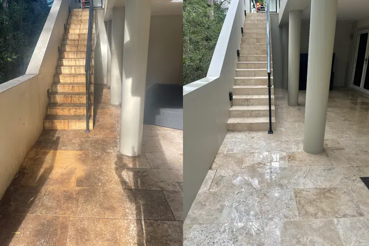 Travertine stairs and landing between rendered walls, before and after pressure washing: stained and dull on the left, clean on the right.